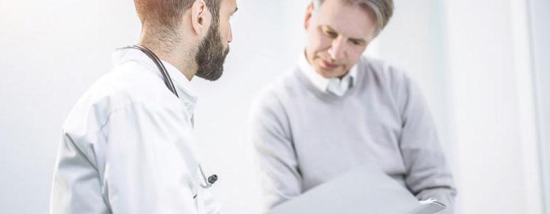 man consulting with doctor