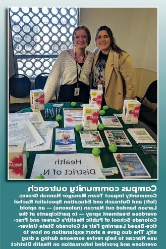 Photo of 社区影响小组 manager Hannah Groves and Outreach and Education Specialist Rachel Larson handing out Narcan (naloxone) - an opiod overdose treatment spray - to participants at the Colorado School of Public Health's Csareer and Practice-Based Learning Fair at Colorado State University. The duo gave a short explanation on how to use Narcan to help revive someone during a drug overdose and provided information on Health District programs.